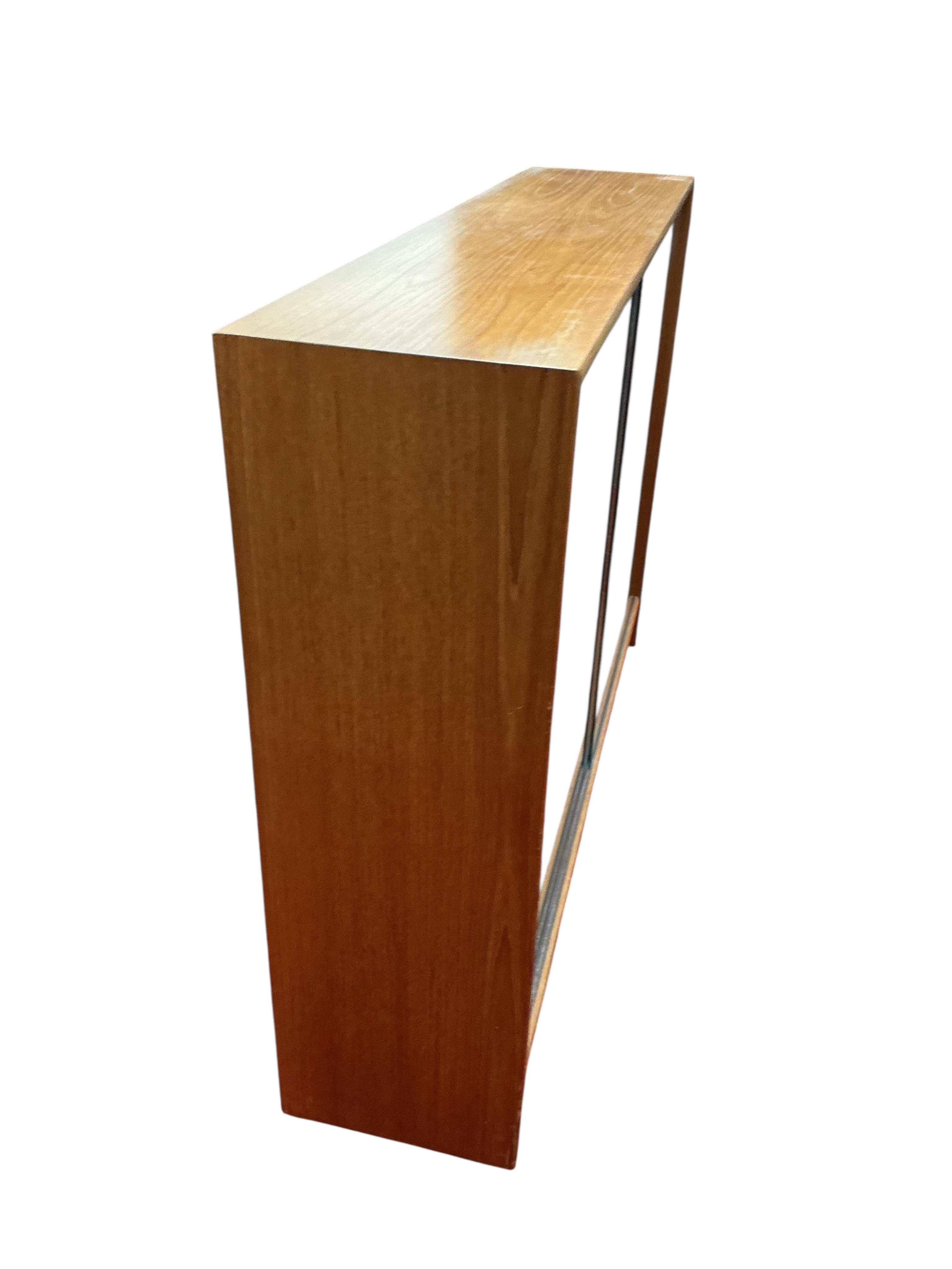 A mid century glazed teak bookcase, width 122cm, depth 28cm, height 90cm